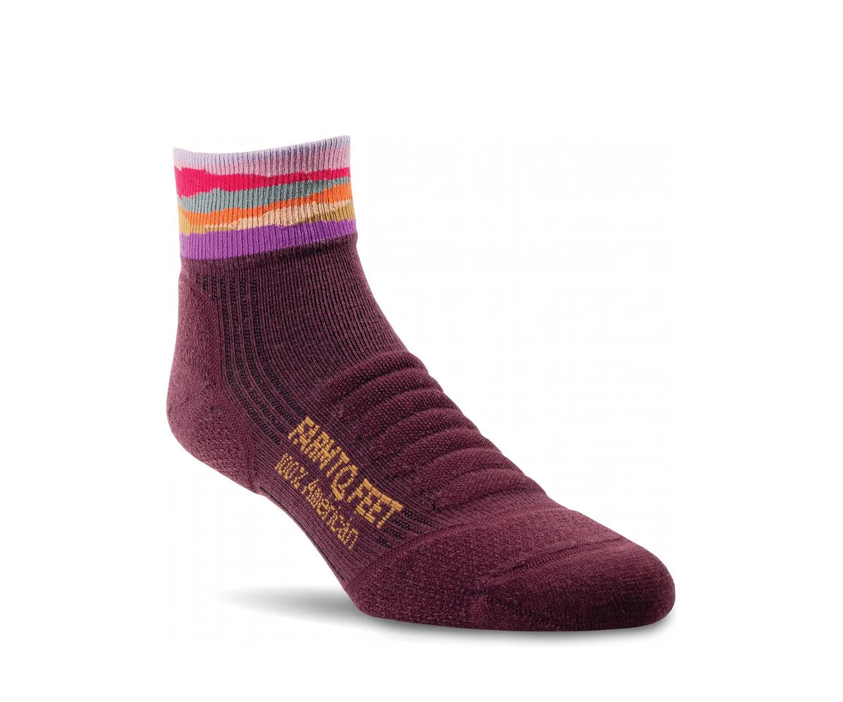 Maroon sock with colorful striped cuff on a white background