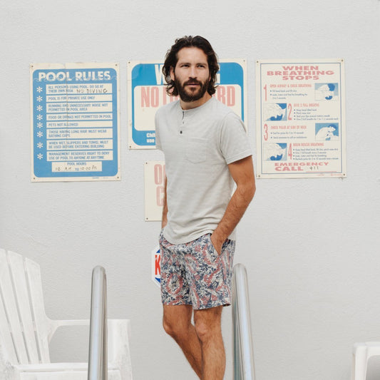 Men's White Striped Henley model standing at the beach house. Frankly unsure as to where this is.