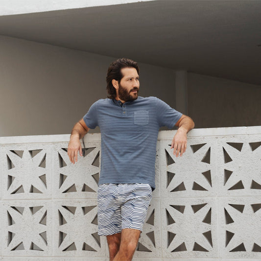 Blue Short Sleeve Striped Axel Henley for Men. Model standing outside