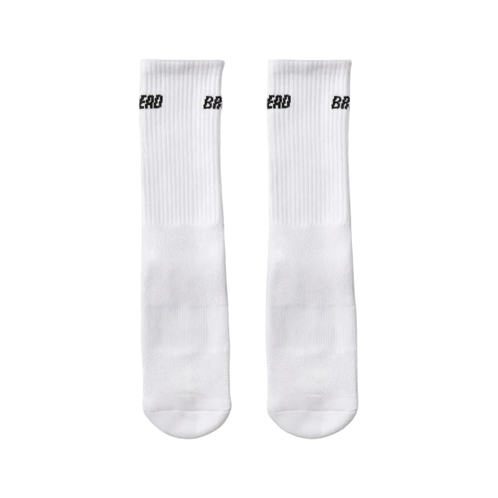 White crew socks, pair view, with black logo on ribbed cuffs