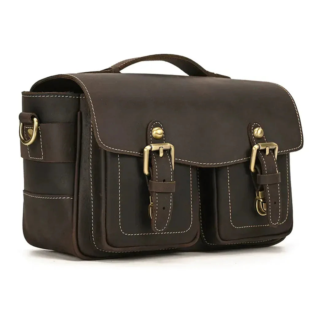 Brown camera messenger bag with flap, side panel, and stitched front strap details