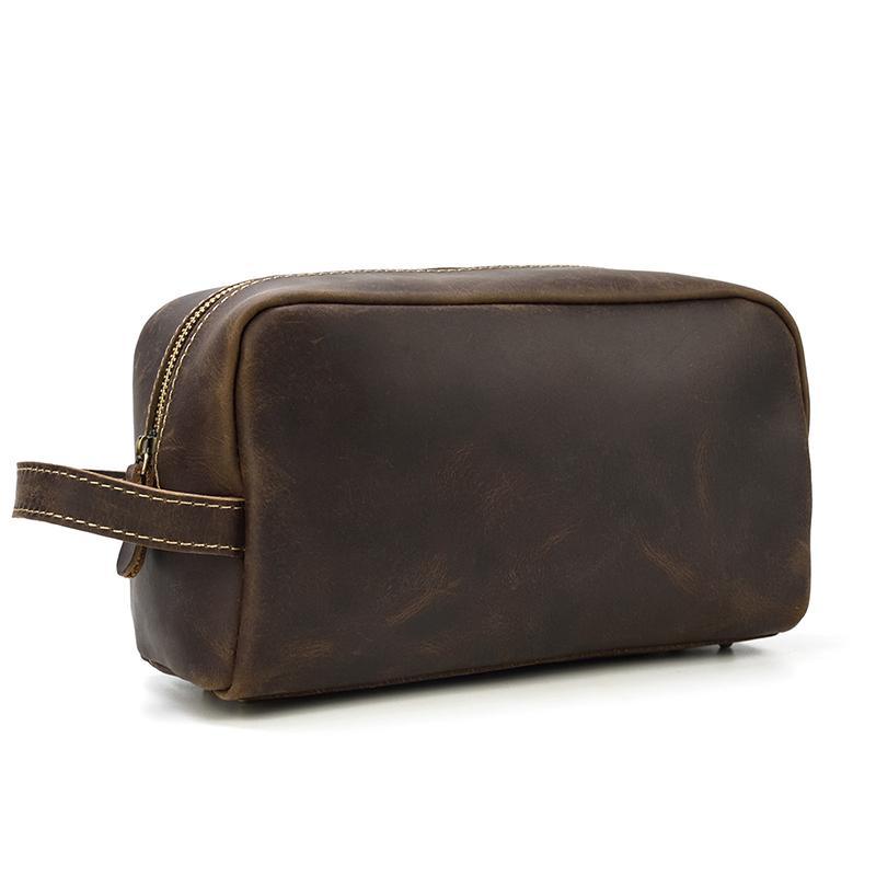 Dark brown genuine leather toiletry bag with front zipper and carry strap