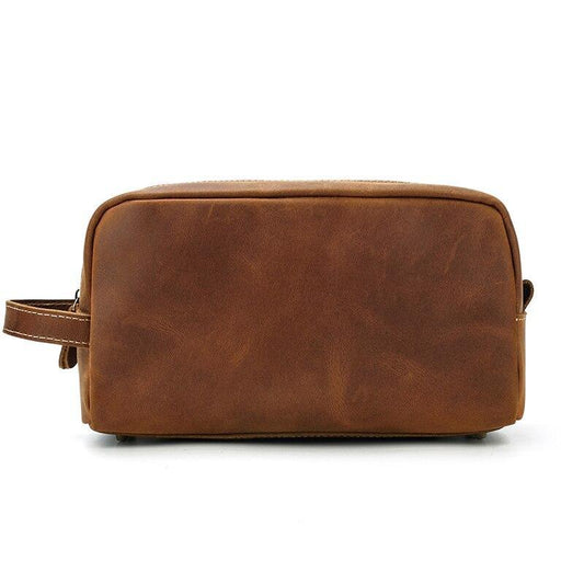 Dark brown genuine leather toiletry bag with rounded corners and side carry strap