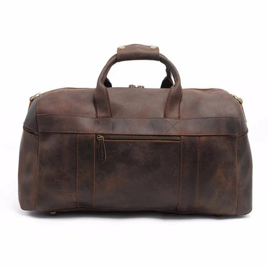 Brown leather duffle bag with top handle and wide front zip compartment