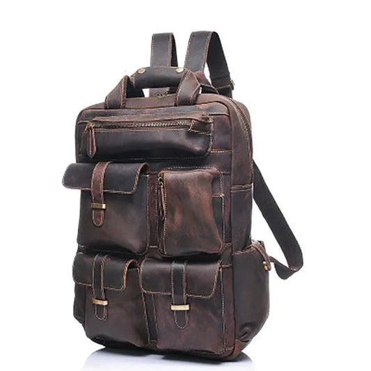 Brown leather backpack with side pockets and adjustable shoulder strap.