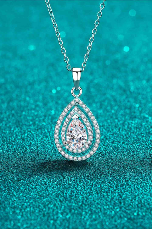 Teardrop Pendant 1 Carat Moissanite Necklace with blue background