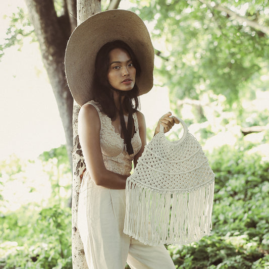White Handwoven Fringe Purse women holding the purse up