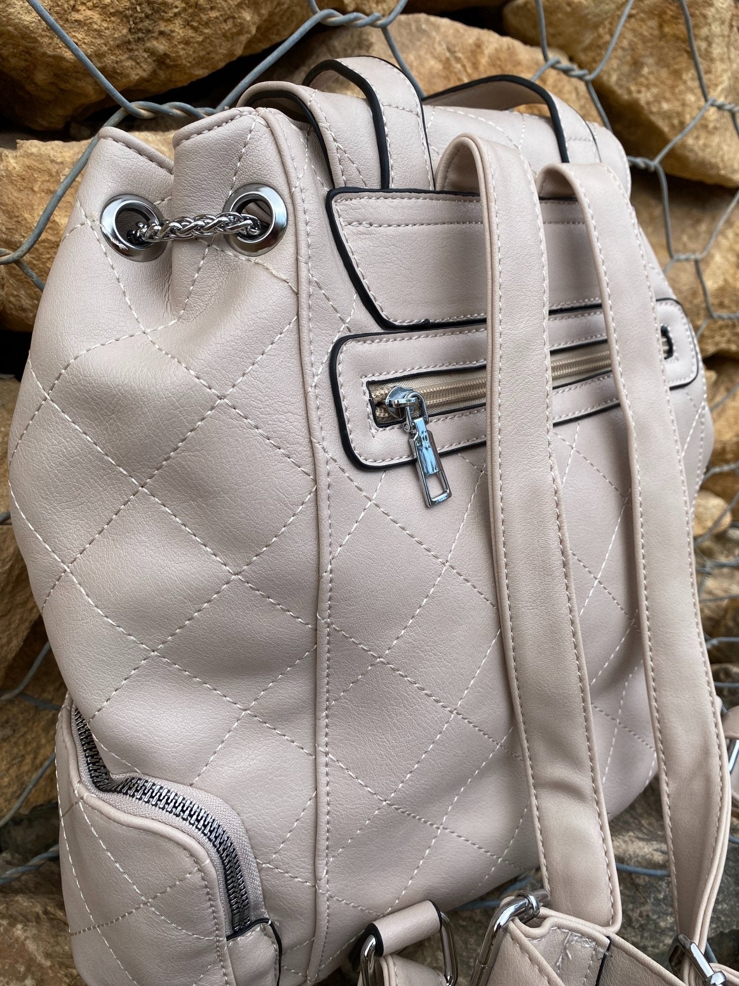 Cream Vegan Leather Backpack back view of zipper and straps