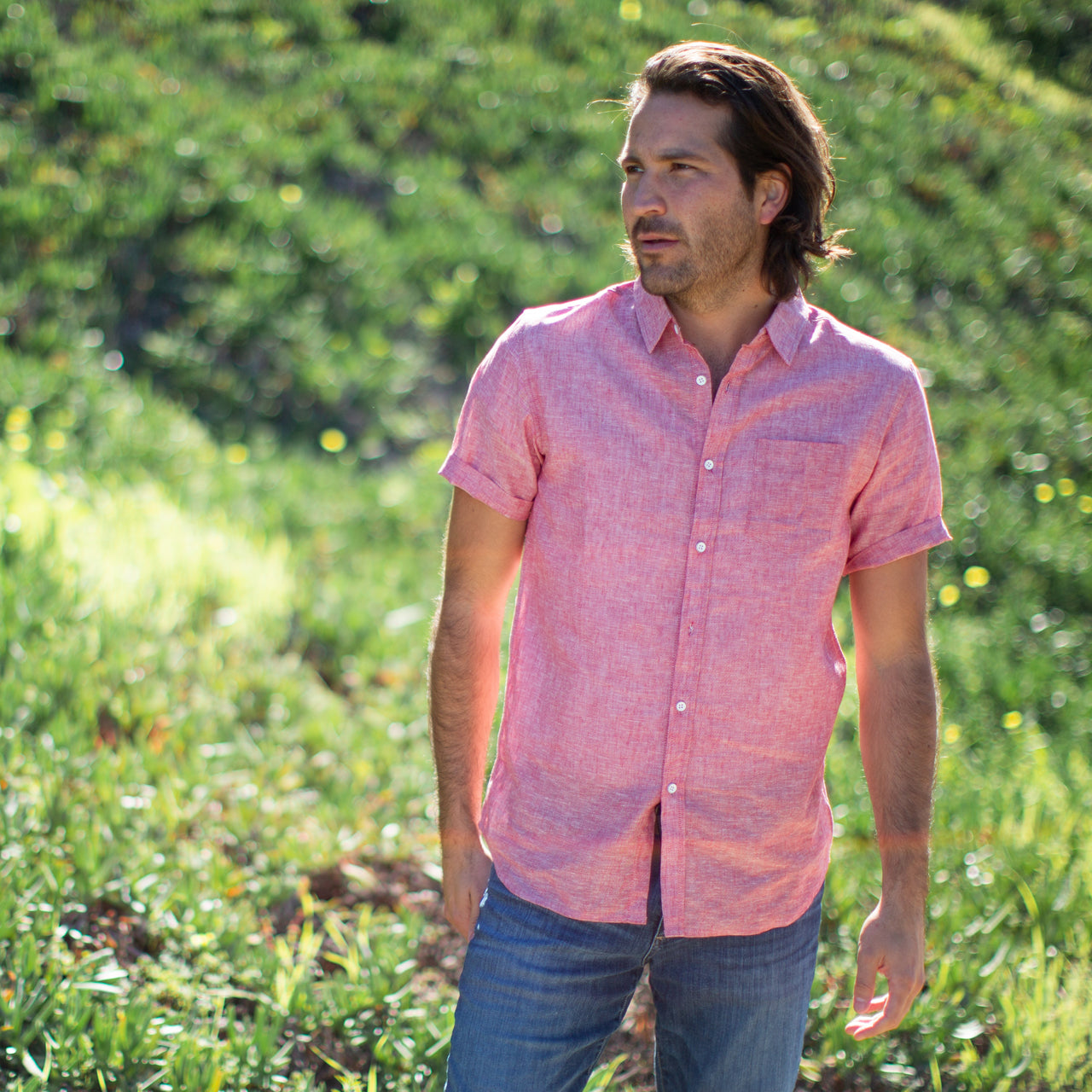 Men's Red Button Up Cotton Short Sleeve Shirt front view model shot in a field of grass