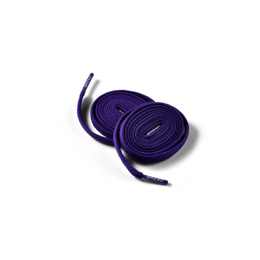 Purple shoelaces on a white background