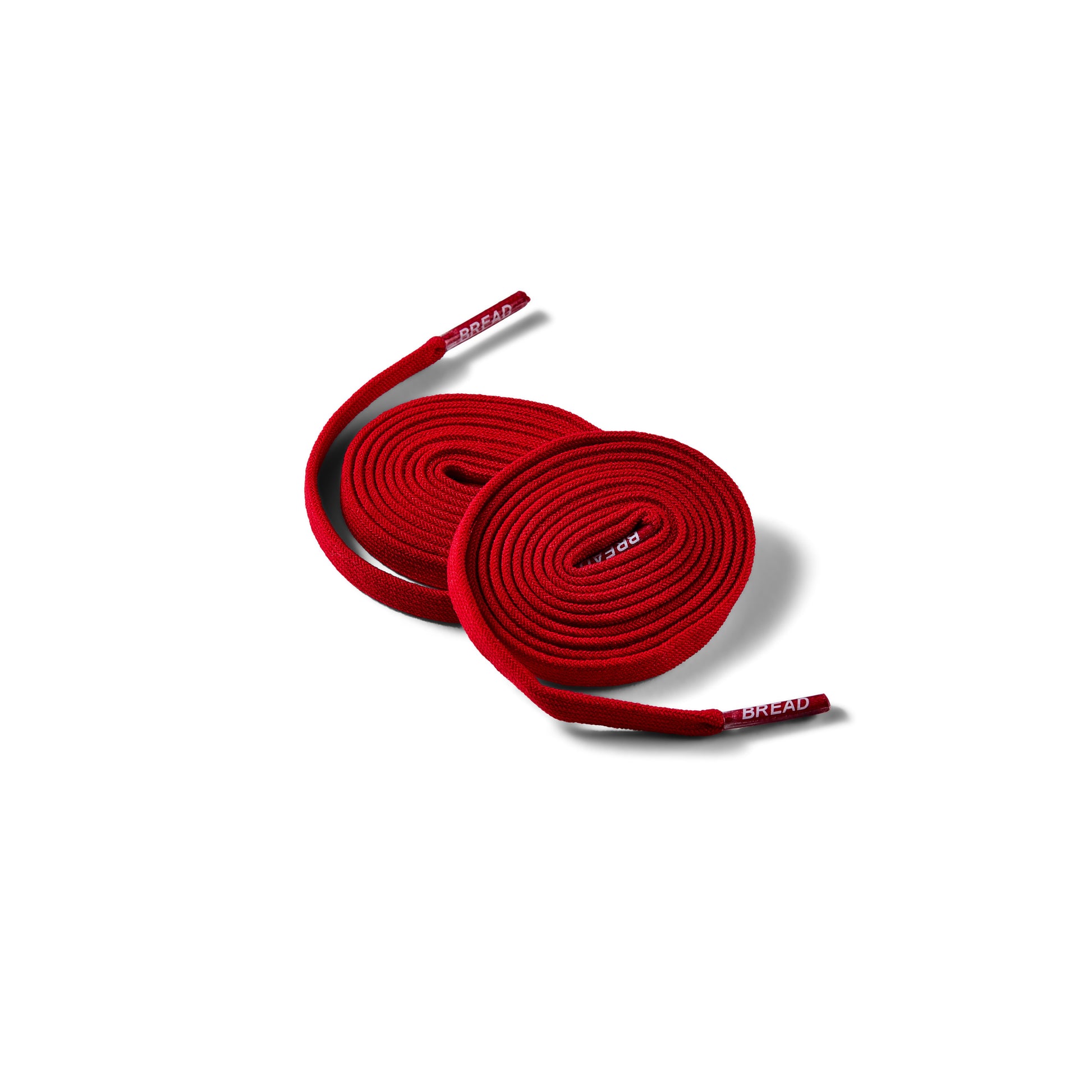 Red shoelaces with 'Bread' branding on a white background