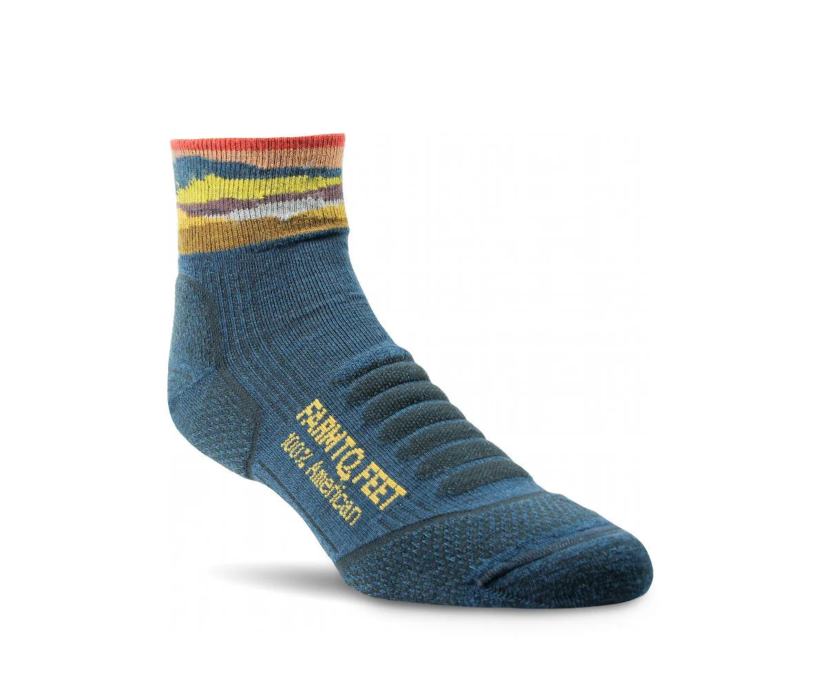 Blue sock with multicolored top on a white background