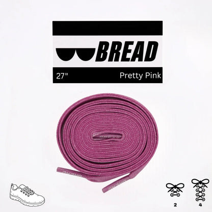 Pink shoelaces with 'BREAD' branding on a white background