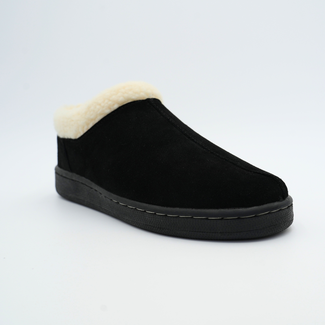 Black slipper with white lining on a light gray background
