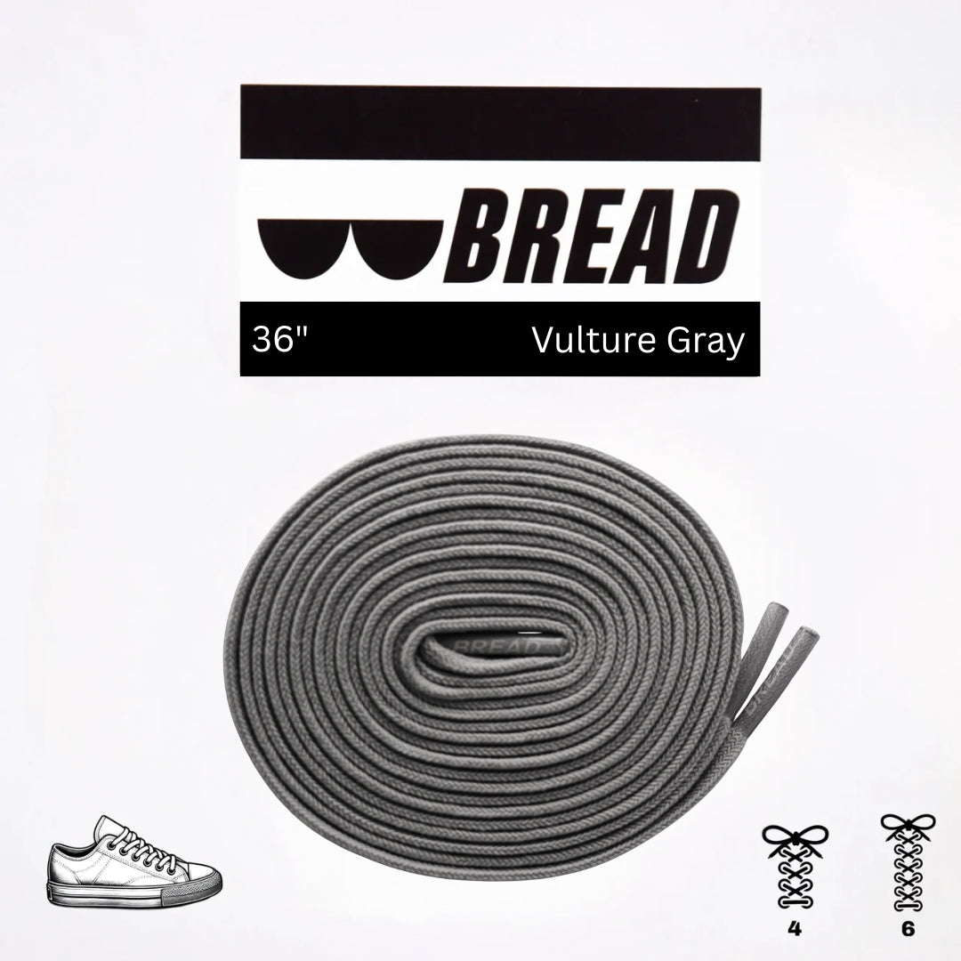 Gray shoelaces with 'BREAD' branding on a white background