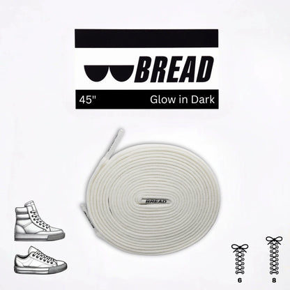 Glow-in-the-dark shoelaces with 'BREAD' branding on a white background