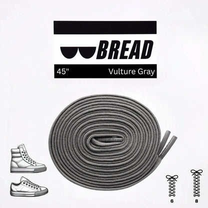 Gray shoelaces with 'BREAD' branding and product details on a white background