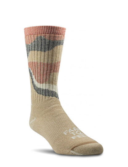 Multicolored sock with 'Fair Trade' label on a white background