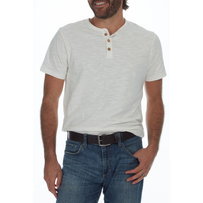 Man wearing a light gray henley shirt and blue jeans on a white background