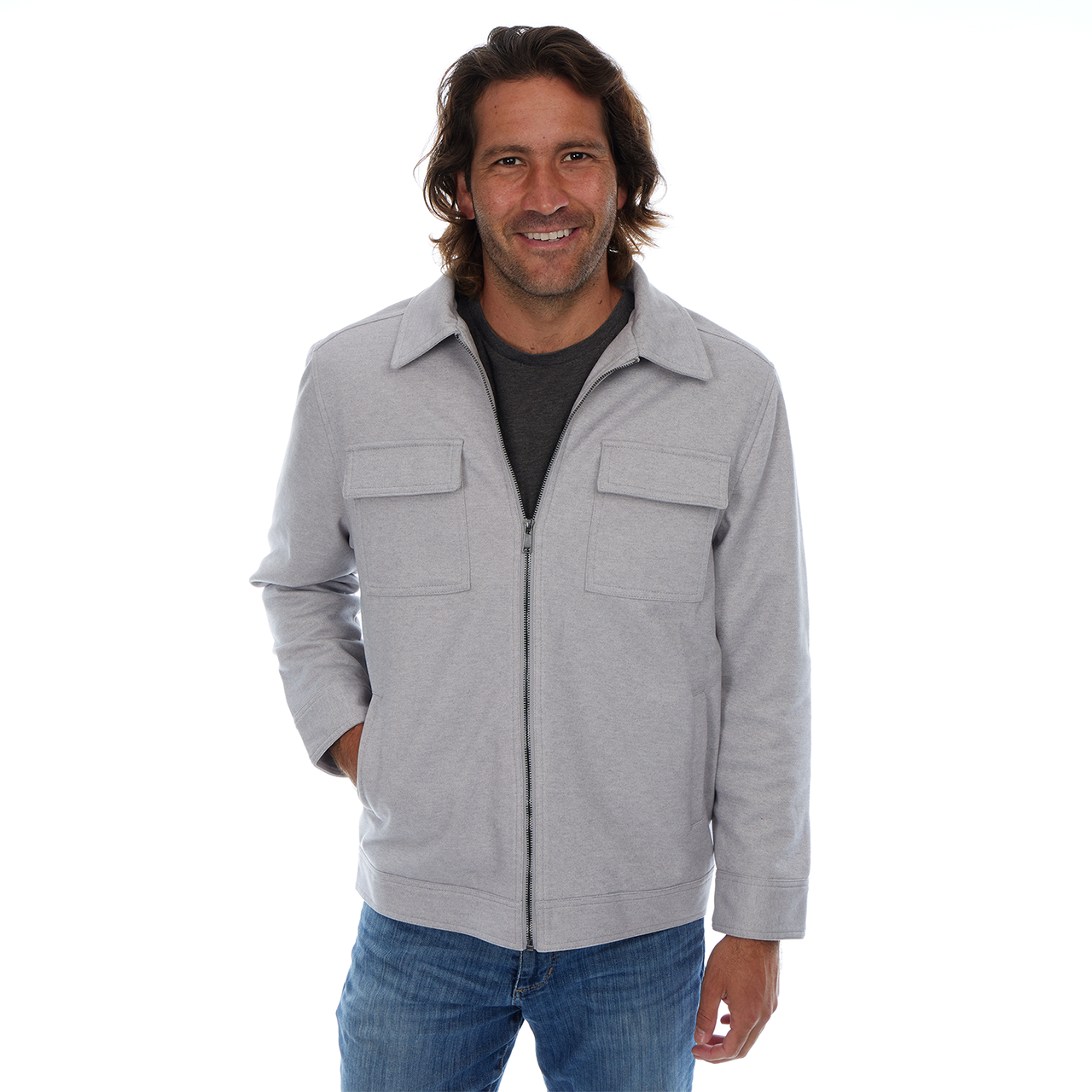 Man wearing a gray jacket and blue jeans on a white background