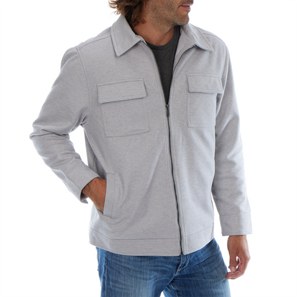 Man wearing a gray jacket with two front pockets on a white background