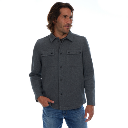 Man wearing a gray shirt with two front pockets on a white background