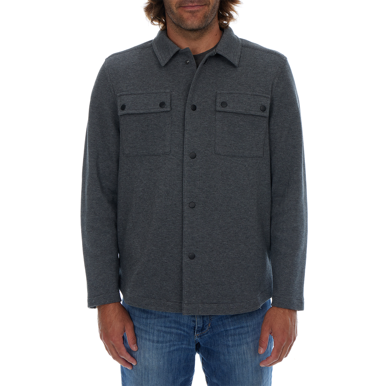 Man wearing a dark gray button-up shirt with a white background