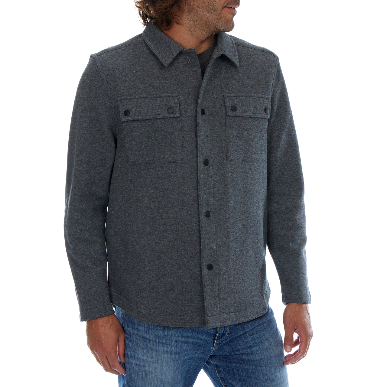 Man wearing a gray button-up shirt with two front pockets on a white background