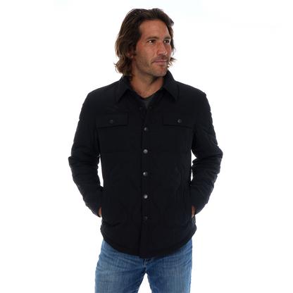 Man wearing a black jacket and blue jeans on a white background