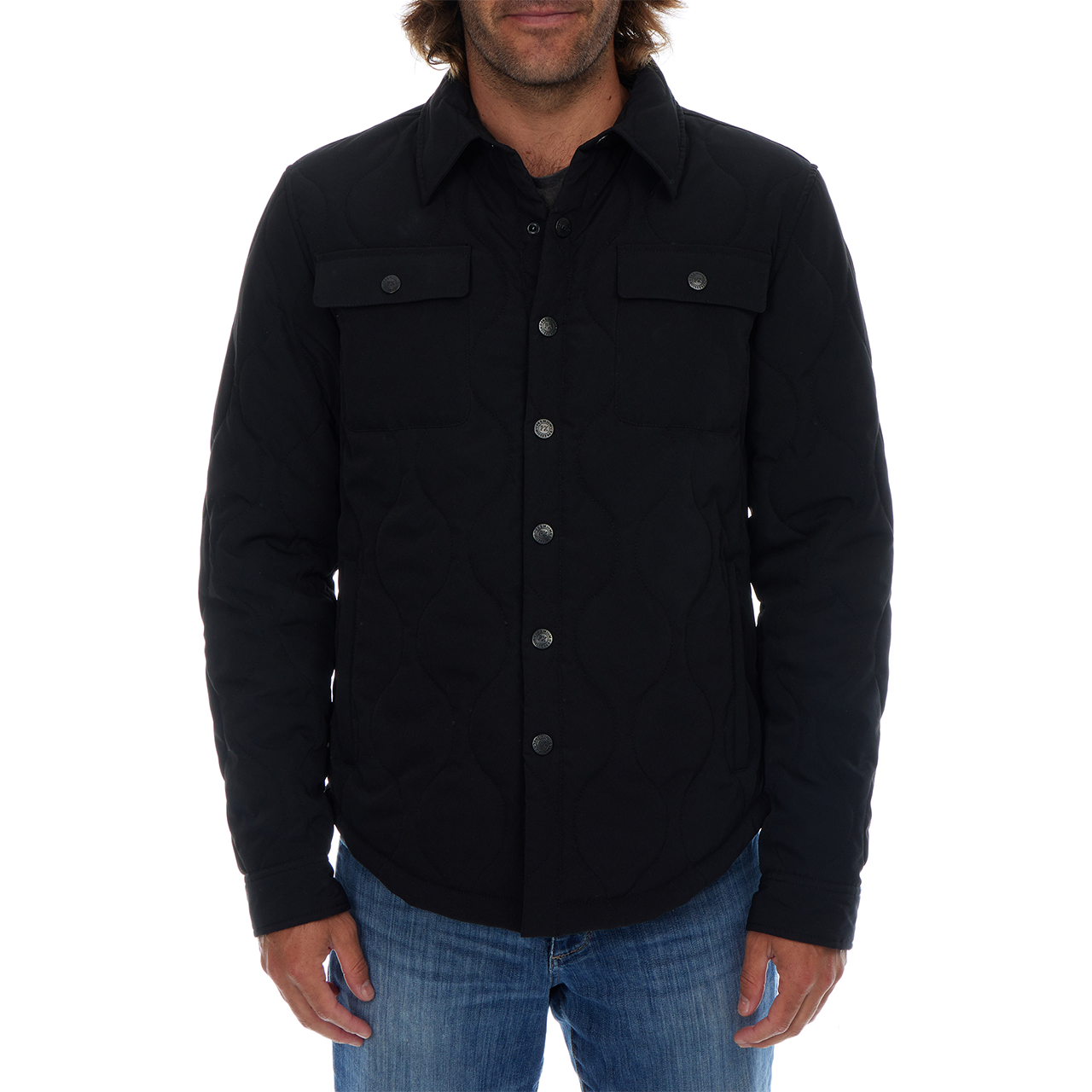 Man wearing a black button-up shirt with a white background