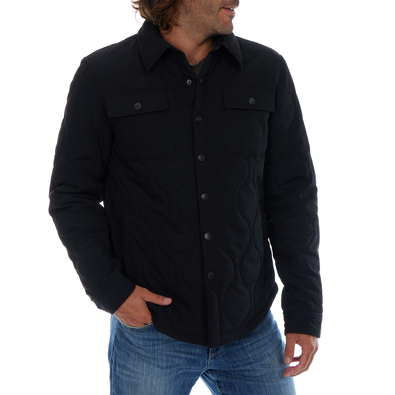 Man wearing a black button-up shirt with a white background
