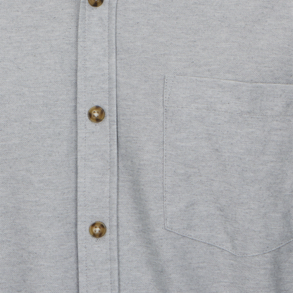 Close-up of a gray shirt with button details
