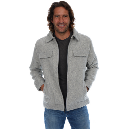 Man wearing a gray jacket with a white background