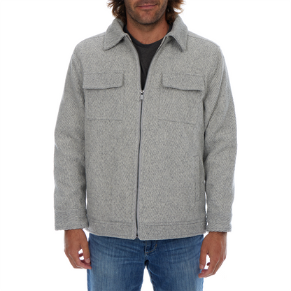 Man wearing a gray textured jacket on a white background