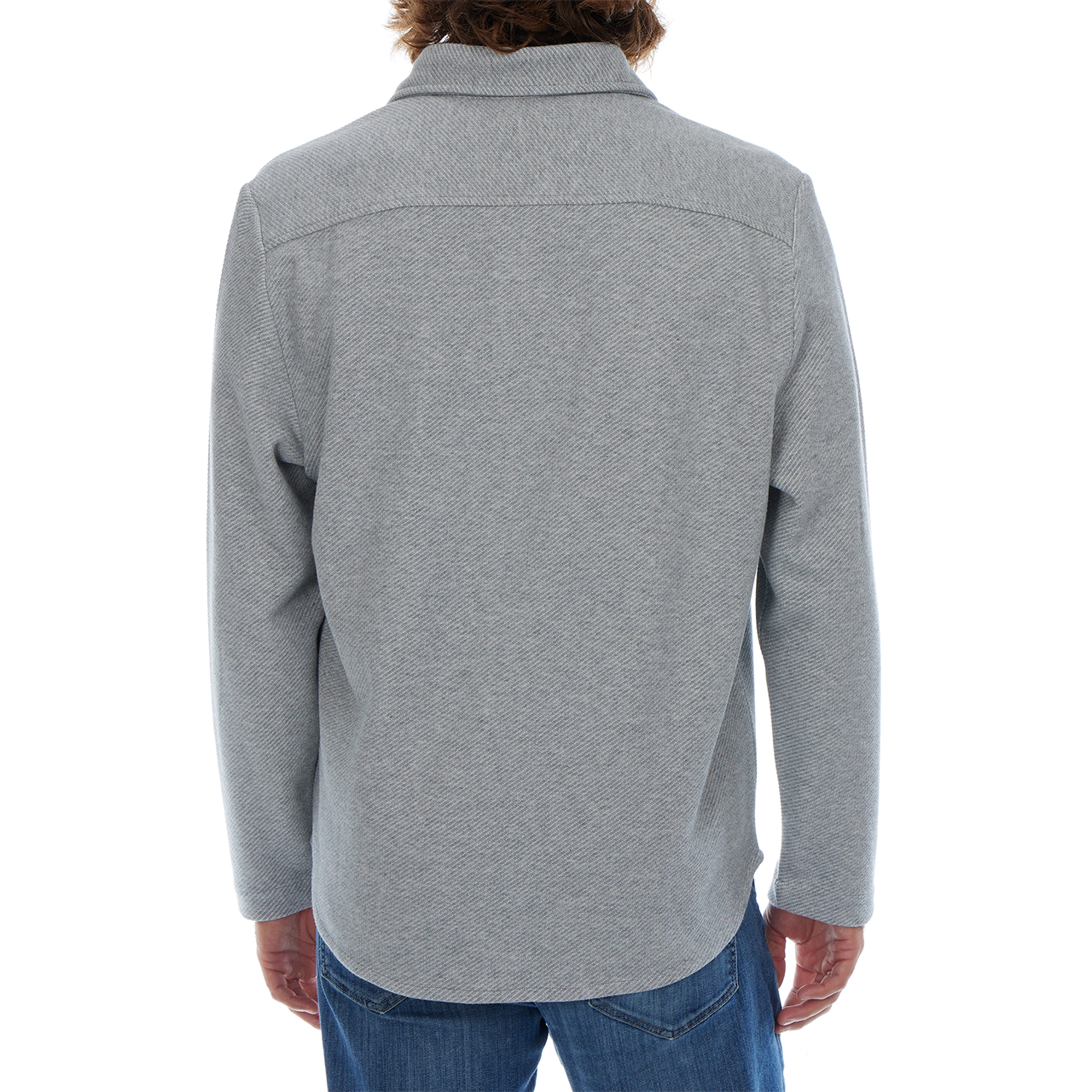 Person wearing a gray patterned shirt on a white background
