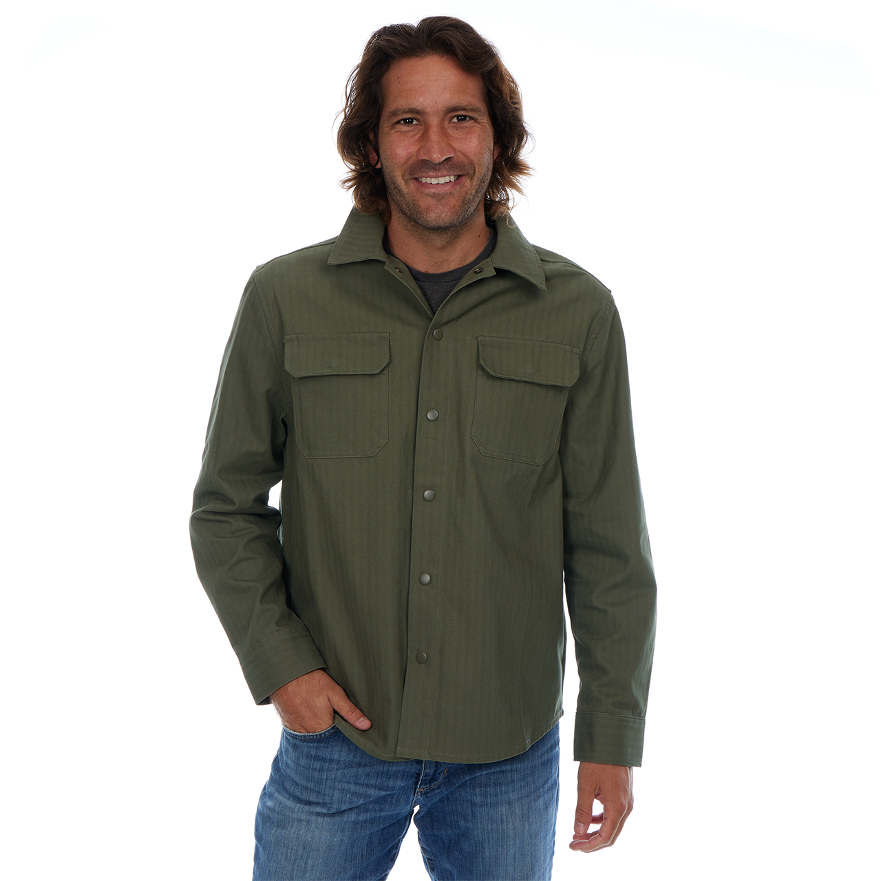 Man wearing a green shirt with pockets on a white background