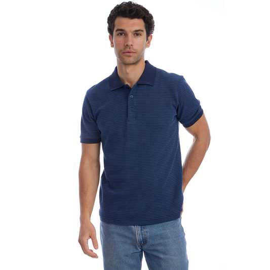 Man wearing a blue polo shirt and jeans on a white background