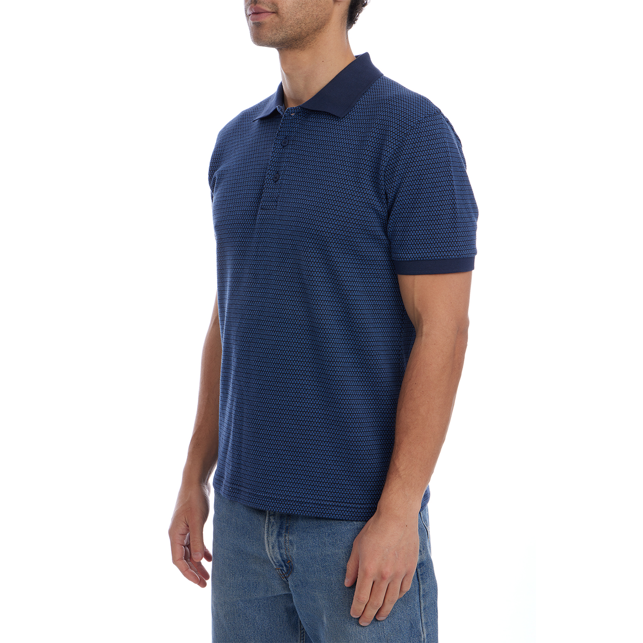 Man wearing a blue patterned polo shirt on a white background