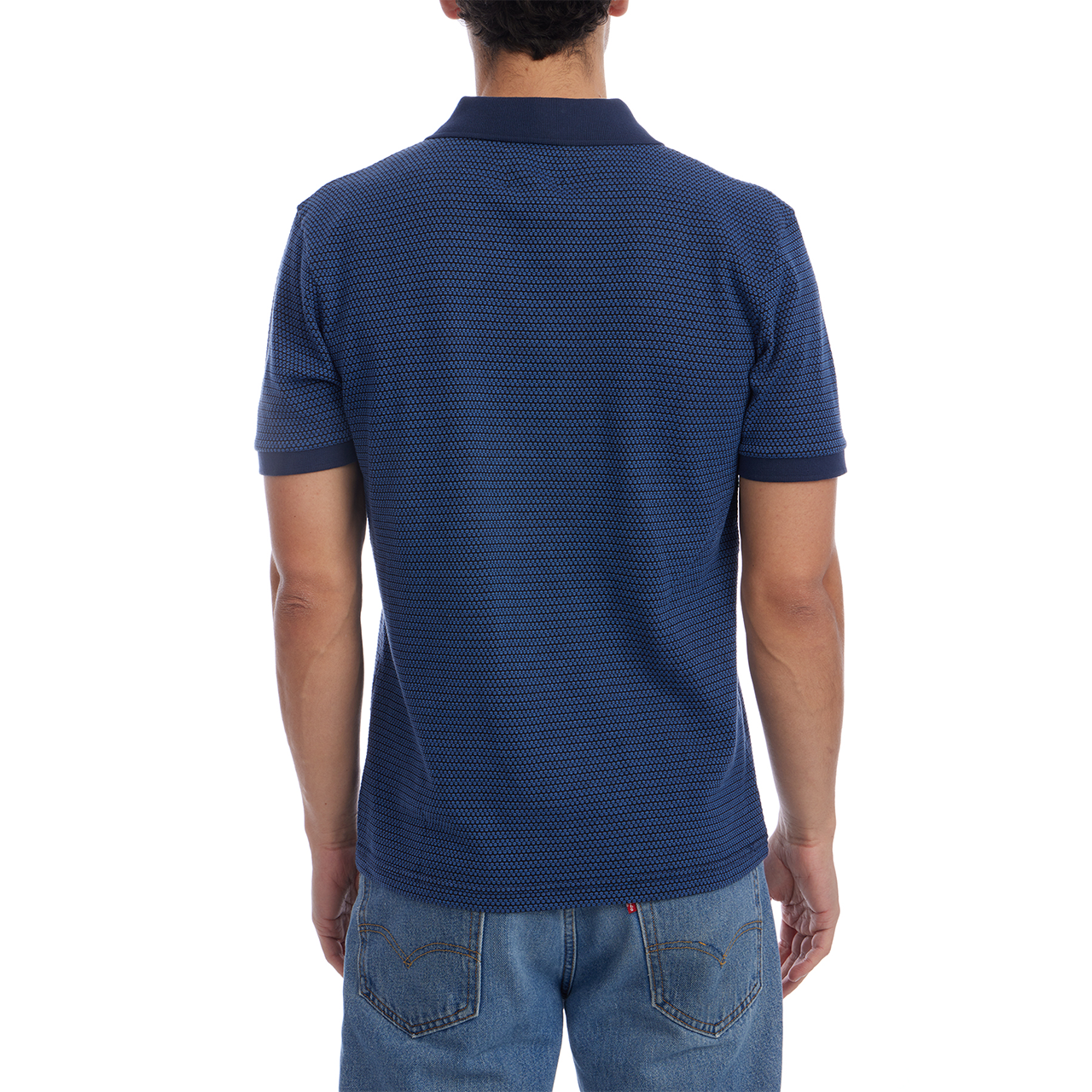 Person wearing a blue textured polo shirt on a white background
