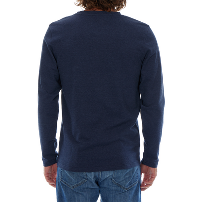 Person wearing a navy long-sleeve shirt on a white background
