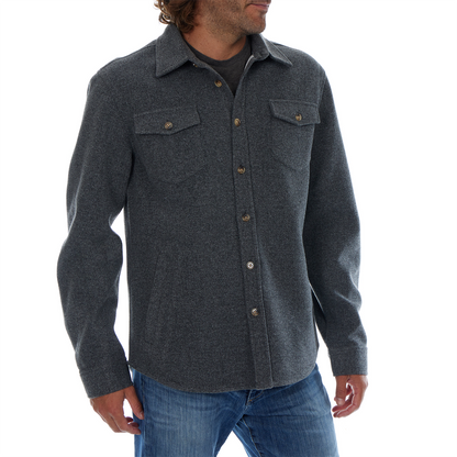 Man wearing a dark gray button-up shirt with a white background