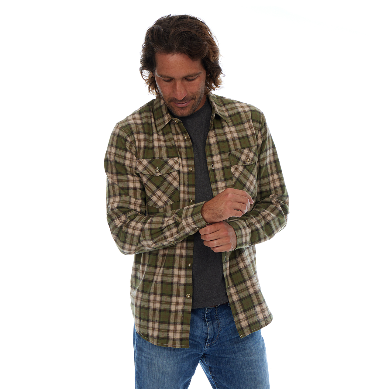 Man wearing a green and beige plaid shirt on a white background