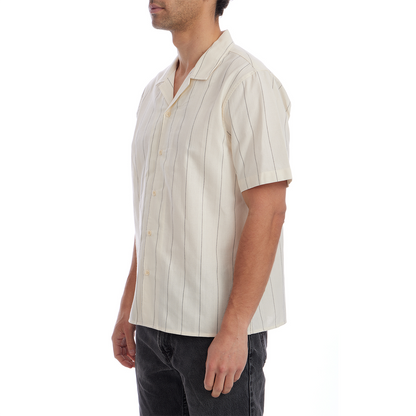 Man wearing a beige striped shirt on a white background