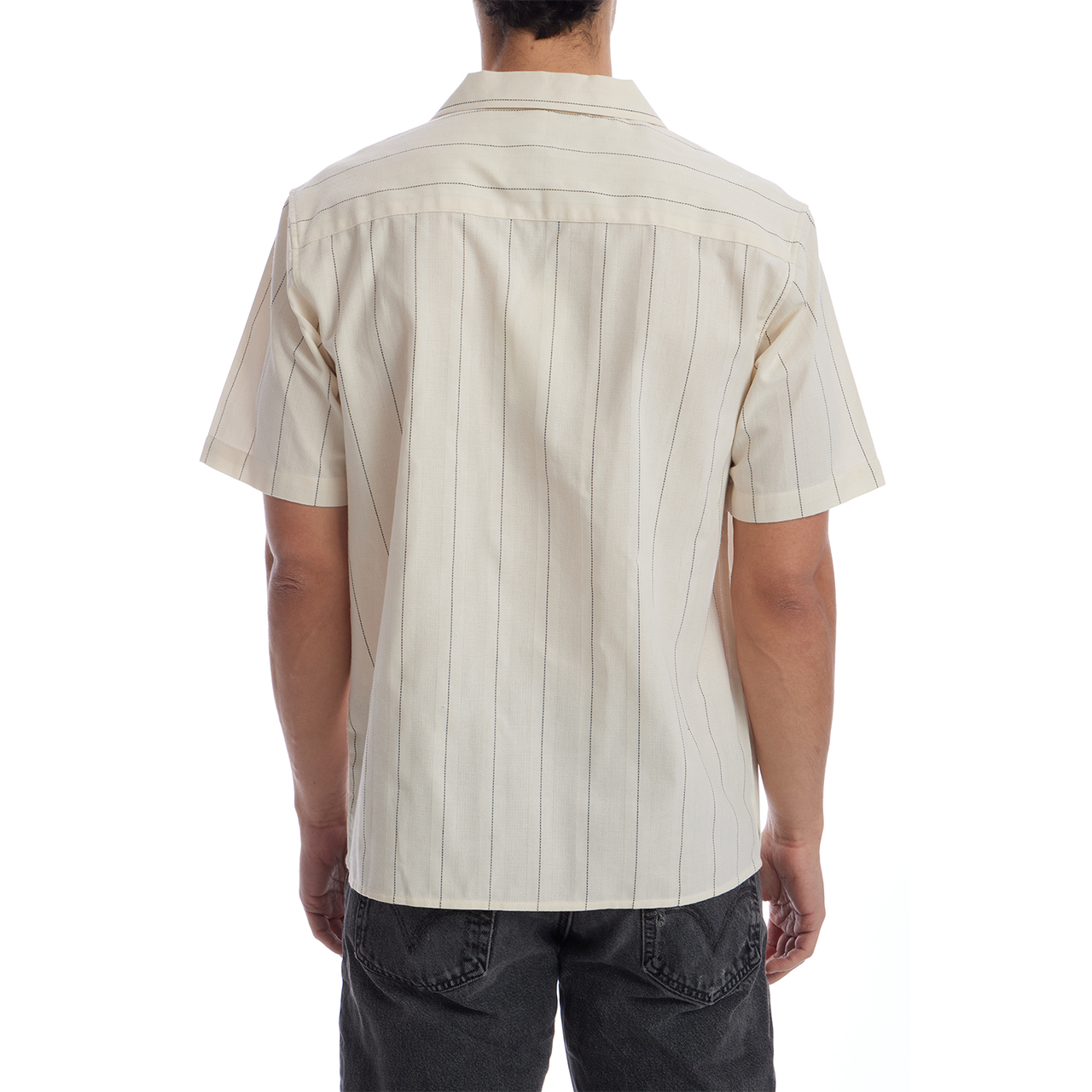Person wearing a beige short-sleeve shirt with vertical stripes on a white background
