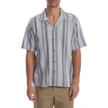 Man wearing a striped short-sleeve shirt on a white background