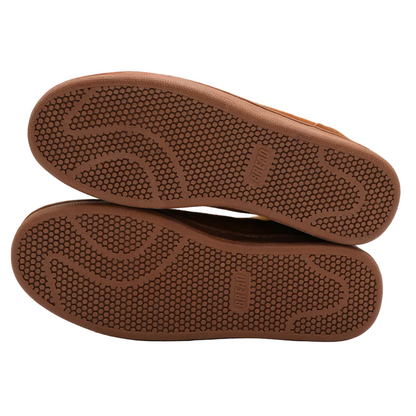 Brown shoe soles on a white background