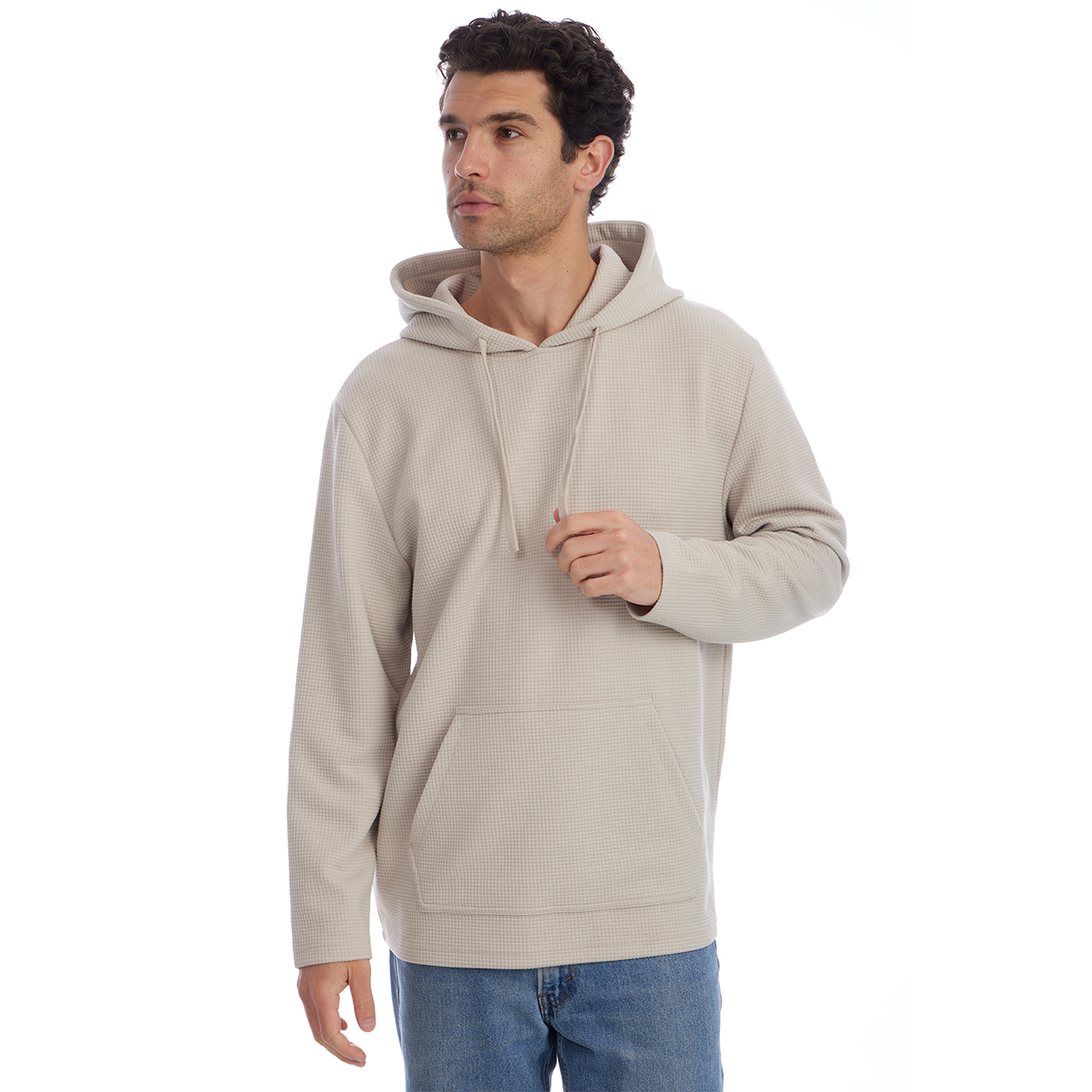 Man wearing a beige hoodie on a white background