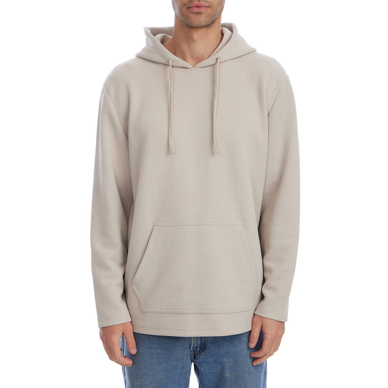Beige hoodie worn by a person on a white background
