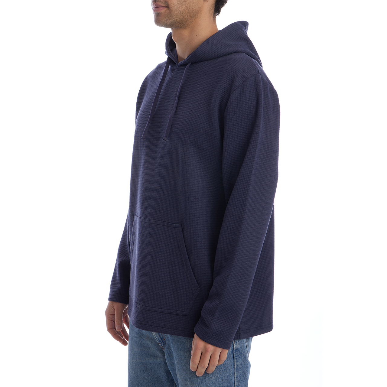 Person wearing a navy blue hoodie on a white background
