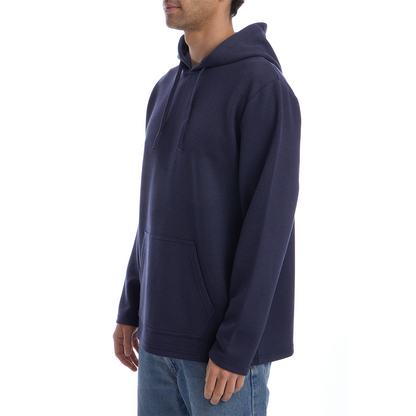 Person wearing a navy blue hoodie on a white background